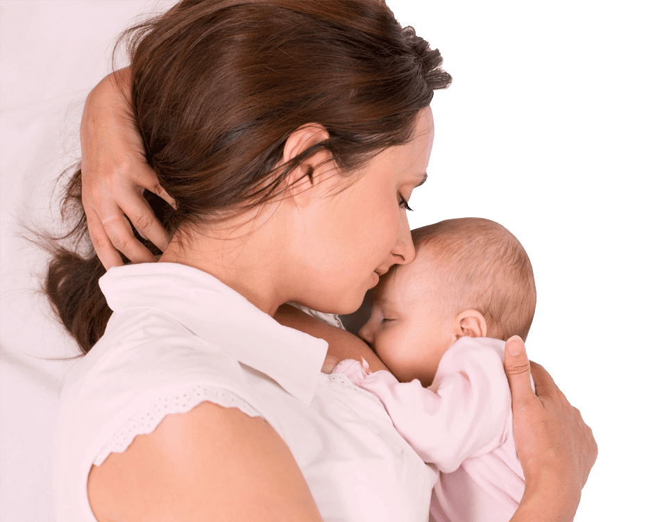 A woman holding her baby in her arms.