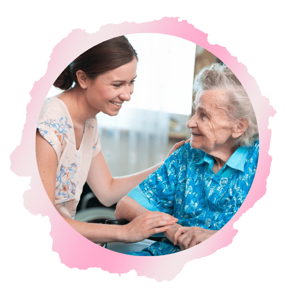 A woman and an elderly person smiling for the camera.