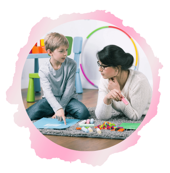 A woman and child sitting on the floor